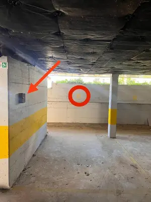 an empty room with a red arrow on a wall at Boutique Sozopol in Sozopol