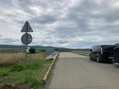 a van is parked on the side of a road at Brymonte Studio, Sunny Day 6 in Tŭnkovo