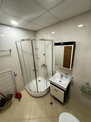 a bathroom with a shower and a sink at Sea view Prestige Fort beach Apartment in Sveti Vlas