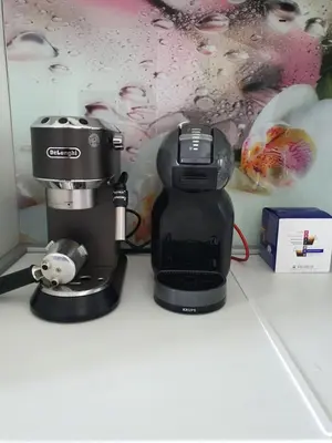 a coffee maker sitting on top of a counter at Луксозен апартамент в Резиденция Лазурен бряг in Burgas City