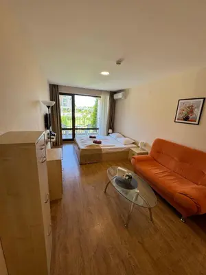 a living room with a couch and a bed at Sea View Premier Fort Beach Sveti Vlas in Sunny Beach