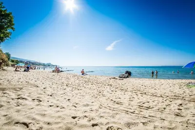 a group of people on a beach near the water at Sea View Premier Fort Beach Sveti Vlas in Sunny Beach