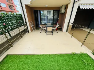 a patio with chairs and a table on a balcony at CHERNO MORE 107 - 19 APARTMENT Nessebar in Nesebar