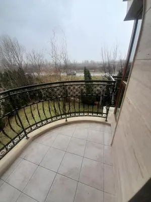 a balcony with a black railing and a view at 2 Room Apartment Harmony Suites Komplex in Sunny Beach