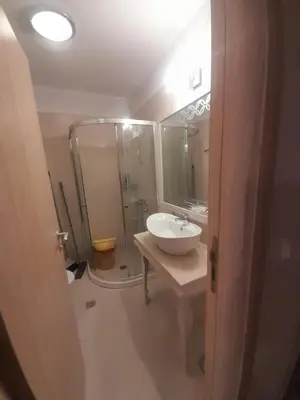 a bathroom with a sink and a shower at 2 Room Apartment Harmony Suites Komplex in Sunny Beach