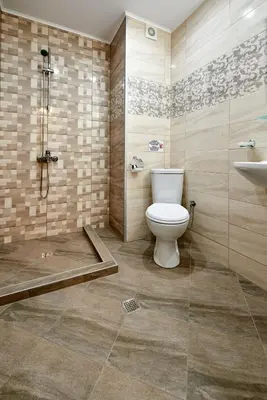 a bathroom with a toilet and a shower and a sink at Апартамент Пенека in Pomorie