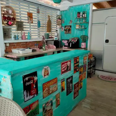 a kitchen with a blue counter and a refrigerator at каравана ТРОПИК-ЕКЗОТИК А 17 in Sozopol