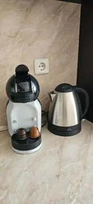 a blender and a tea kettle on a counter at Sunny Day Pomorie in Pomorie