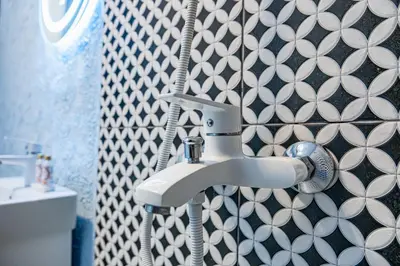 a bathroom with a sink and aaucet at Flamingo Top Center Apartment in Varna City