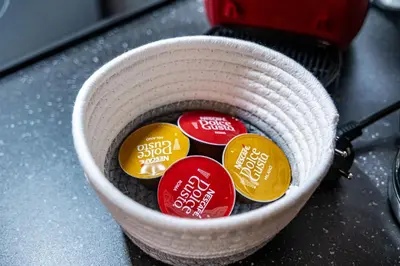 a bucket filled with four different colored buttons at Flamingo Top Center Apartment in Varna City