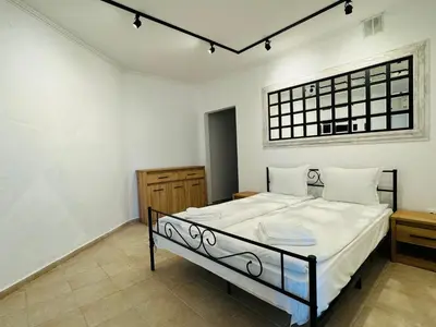 a bedroom with a bed with white sheets and a window at MIRAMAR A 501 Private Apartment Sunny Beach in Sunny Beach