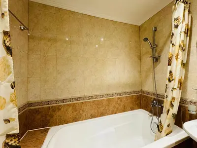 a bathroom with a bath tub and a sink at MIRAMAR A 501 Private Apartment Sunny Beach in Sunny Beach