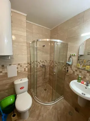 a bathroom with a shower and a toilet and a sink at Studio Kristina in Pomorie