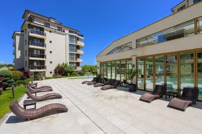 a row of benches in front of a building at Infinity view 2 Shkorpilovci in Shkorpilovtsi
