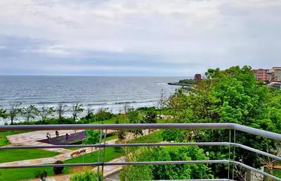 a view of the ocean from a balcony at Амон Ра in Primorsko