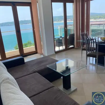 a living room with a couch and a glass table at 2 Bed Suite, Exclusive Sea Views in Sozopol