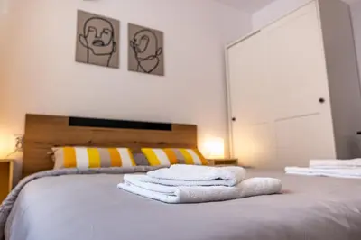 a bedroom with a bed with towels on it at Cozy Central Apartment Varna & Parking - subject to availability in Varna City