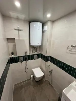 a bathroom with a toilet and a sink at Sea Treasure in Varna City