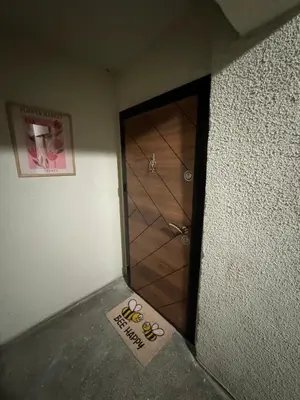 a door in a room with a sign in front of it at Sea Treasure in Varna City