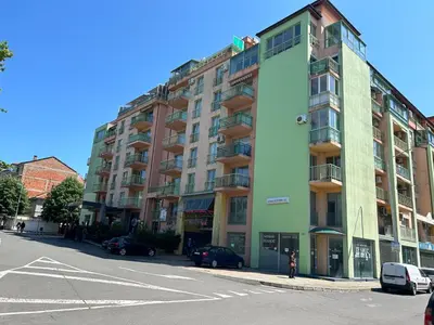 a large apartment building on the side of a street at Nesebar City Apartment in Nesebar