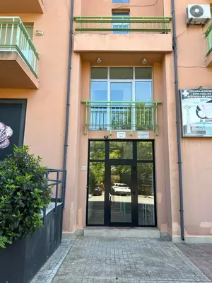 an entrance to a building with a glass door at Nesebar City Apartment in Nesebar