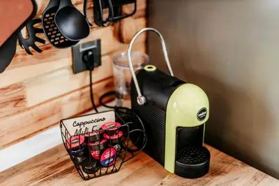 a coffee maker sitting on top of a counter at Lion's Forest in Atiya