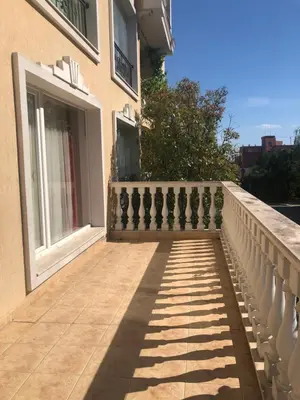 a balcony of a building with a fence at Apartment Alex Sveti Vlas in Sveti Vlas