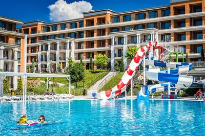 a hotel swimming pool with a water slide at Private Apartment in PREMIER FORT Beach Aparthotel in Sveti Vlas