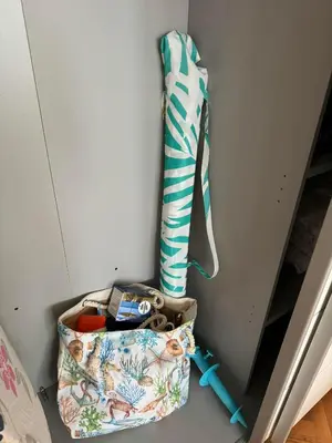 a bag of items sitting next to a wall at Апартамент Панорама Славейков in Burgas City