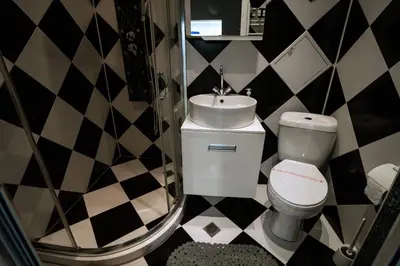 a bathroom with a toilet and a sink at Seaside Apartament in Burgas City