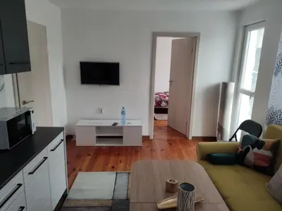 a living room with a couch and a table at rozi in Burgas City