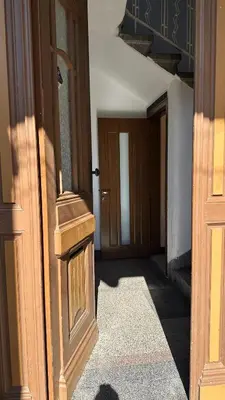 an entrance to a room with a door and a hallway at Spacious Apartment in Central Burgas in Burgas City