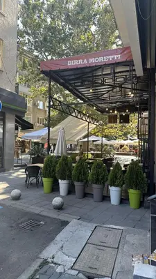 a group of potted plants sitting under a canopy at Spacious Apartment in Central Burgas in Burgas City