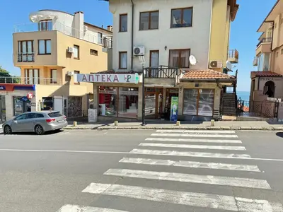a car parked on a street in front of a building at Sea la Vie in Sozopol