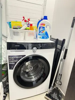 a washing machine with a mop on top of it at Wave & Sea in Sozopol