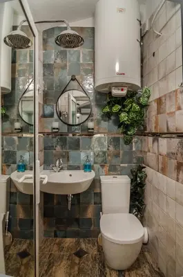 a bathroom with a toilet and a sink at Bella in Nesebar