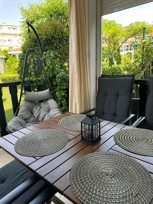 a wooden table with twombermbermbermbermbermbermber at Kambani 1 Apartment in Sveti Vlas