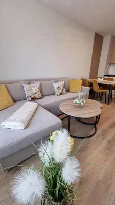 a living room with a couch and a table at Sorrento Sole Mare V&D Luxury Style Apartment in Sveti Vlas