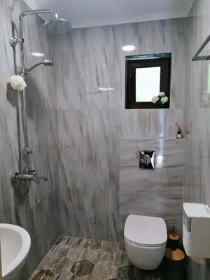 a bathroom with a toilet and a sink at Timeless Sea in Tsarevo