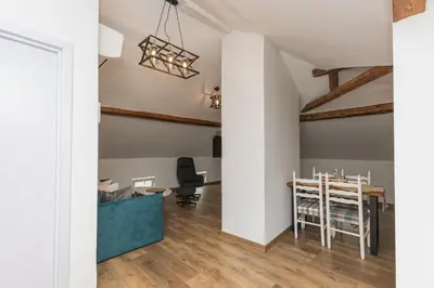 a kitchen and dining room with a table and chairs at The Central House 3 in Burgas City