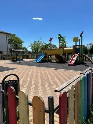 a park with a playground with a slide and swings at Victoria in Varna City