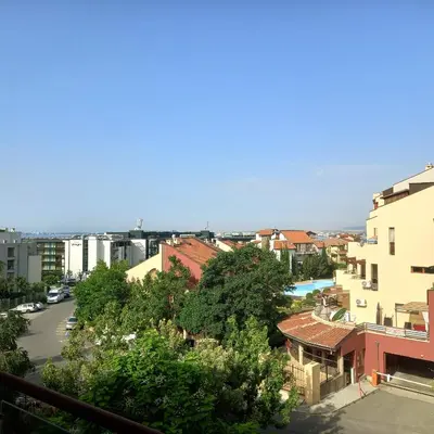 a view of a city from a balcony at Helios Seaview Apartment in Sveti Vlas