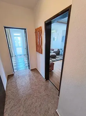 a hallway with two doors leading to a living room at Вила Катажина - Villa Katarzyna in Sozopol