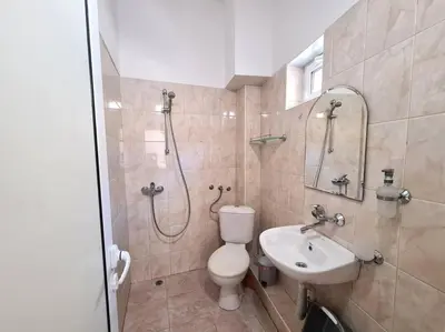 a bathroom with a shower and a toilet and a sink at Mateo Center in Varna City