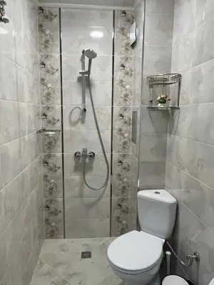 a bathroom with a shower with a toilet and a sink at Sunset studio in Sozopol, with free parking in Sozopol