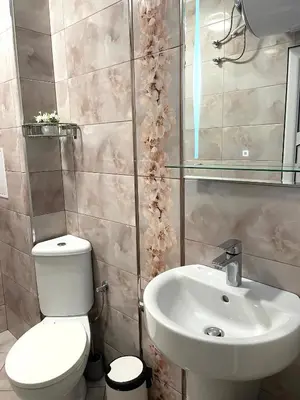 a bathroom with a toilet and a sink at Palms Studio in Sozopol, with free parking in Sozopol