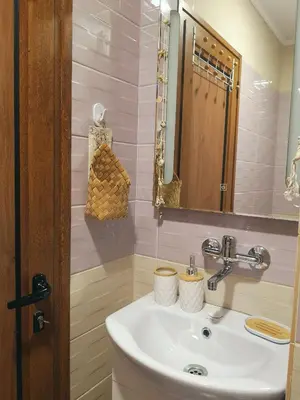 a bathroom with a sink and a mirror at Astell Superior Studio in Burgas City