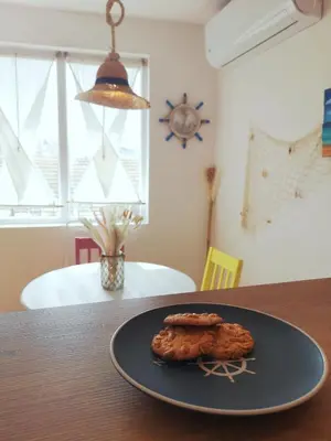 a plate with a cookie on a table at Astell Superior Studio in Burgas City