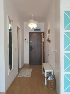 a hallway with a door and a room with a table at Astell Superior Studio in Burgas City