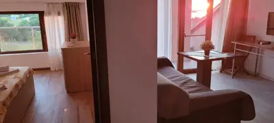 a living room with a couch and a table at Vila Mihnevi in Chernomorets
